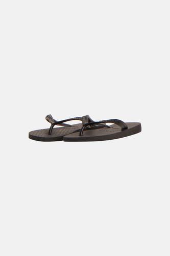 Tongs noirs Havaianas avec brides et semelle texturées.