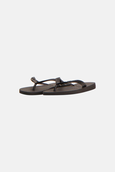 Tongs noirs Havaianas avec brides et semelle texturées.