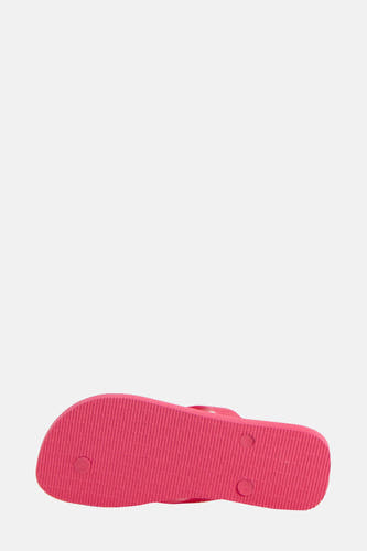 Chaussons roses Havaianas, avec des stries sur la semelle et des détails ronds.