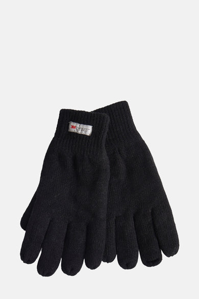 Gants de main d'Access, avec un étiquette isolante visible sur une gant.