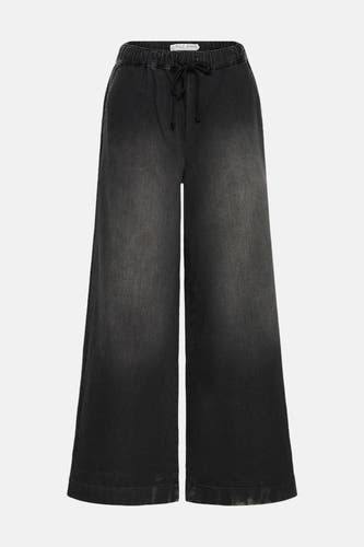 Jean denim noir de PULZ JEANS, avec une ceinture élastique et une jambe large.
