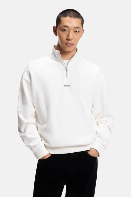 Pull blanc HUGO, avec demi-fermeture éclair et petit logo sur la poitrine.
