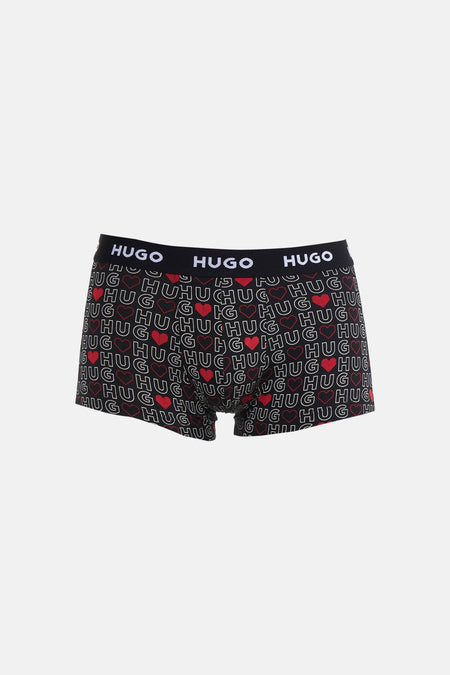 Boxer multicolore de HUGO, avec motif "HUG" répété et cœurs rouges sur tout le boxer.