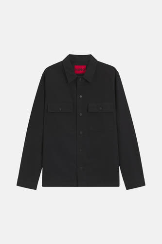 Chemise noire à manches longues de HUGO, avec deux poches po po et une fermeture à boutons.
