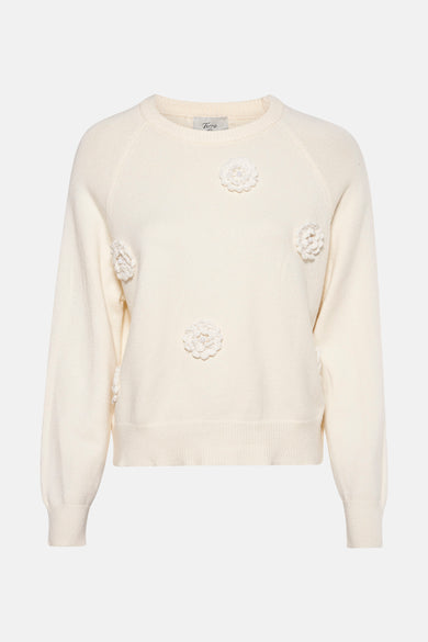 Creme sweater met geborduurde bloemen.
