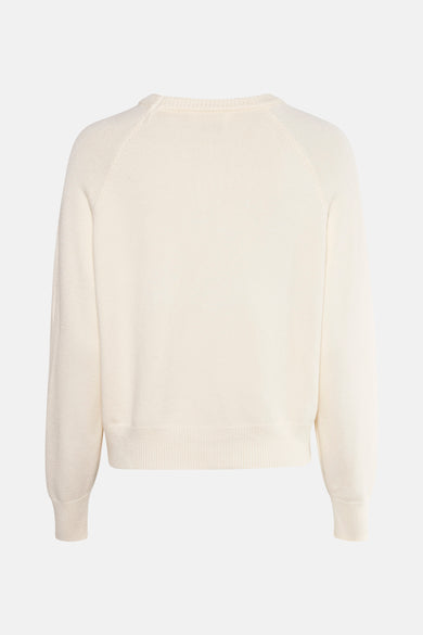 Ivoorwitte trui van gebreide stof.