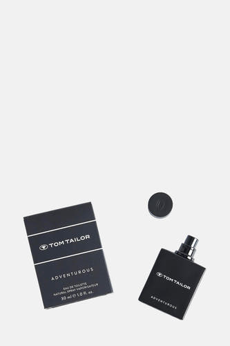 Parfum noir de Tom Tailor, avec bouchon et emballage, posé sur un fond blanc.