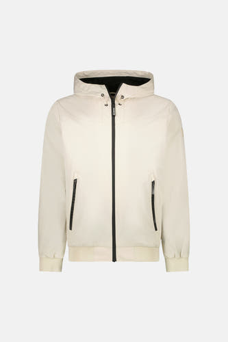 Manteau court beige de Cars, avec capuche et détails noirs comme les fermetures éclair.