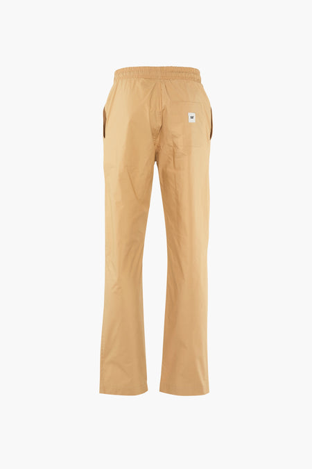 Pantalon beige de CATERPILLAR avec ceinture élastique et poches, vu de derrière.