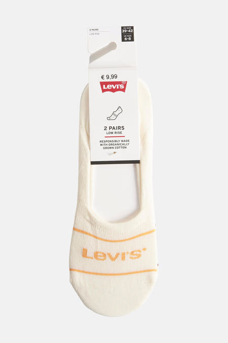 Chaussettes beige de Levi's, avec des rayures oranges et le logo sur la semelle.