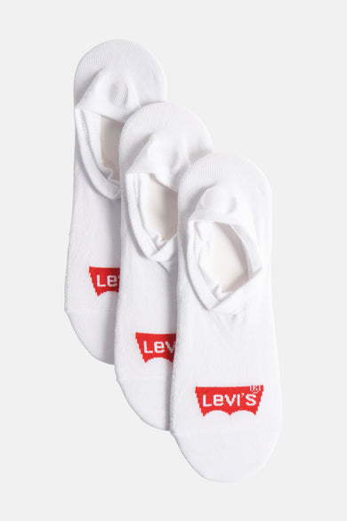 Sneakers blancs de Levi's®, avec logo rouge sur la semelle et modèle bas.