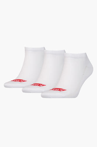 Chaussettes blanches de Levi's® Accessories, en une texture côtelée avec un logo rouge sur la pointe.