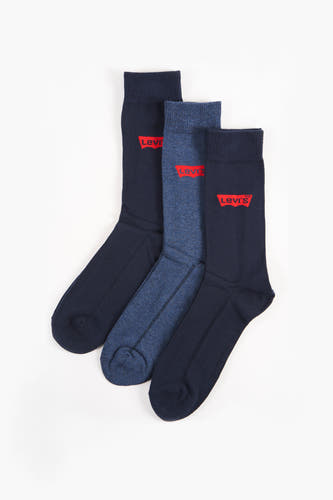 Chaussettes bleues de Levi's® Accessories, avec une texture denim bleue et un logo rouge.