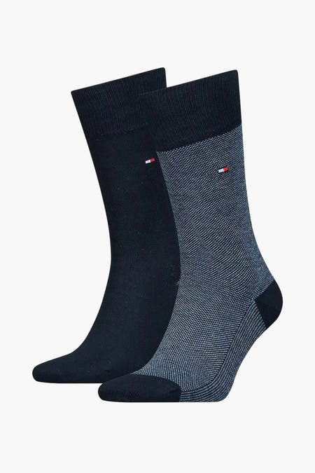 Chaussettes bleues de TOMMY JEANS, une version lisse et une version finement tissée avec le logo de la marque.