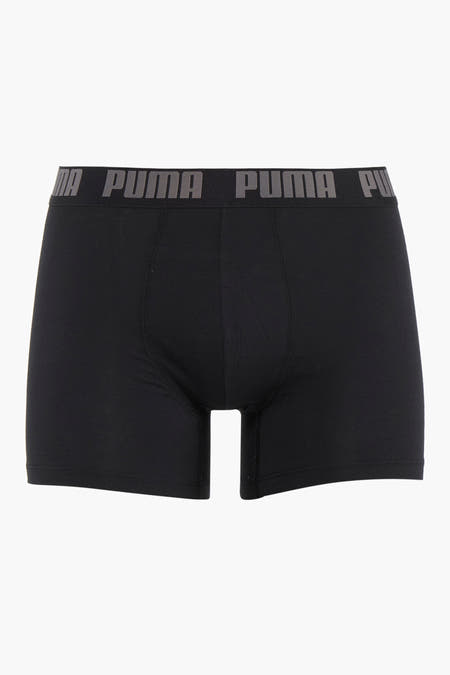 Shorts de boxe noirs PUMA avec une ceinture élastique grise imprimée du logo.