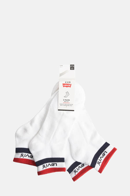 Chaussettes blanches de Levi's avec un bord rouge et marine au niveau du genou.