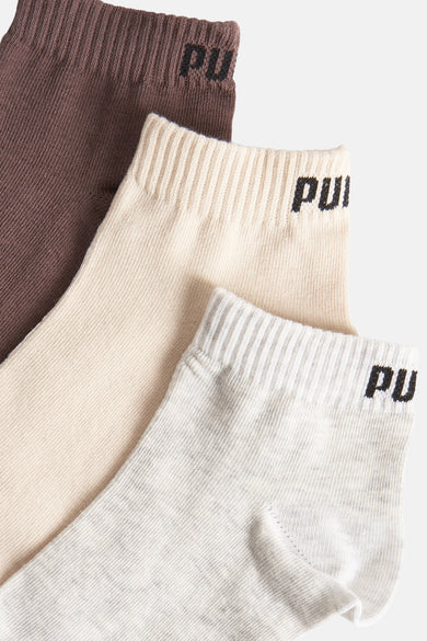 Chaussettes multicolores de PUMA, avec une texture rayée et le logo PUMA.