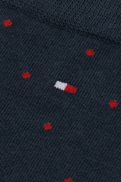 Chaussettes bleues de TOMMY JEANS avec motif de trèfle rouge et logo subtil.