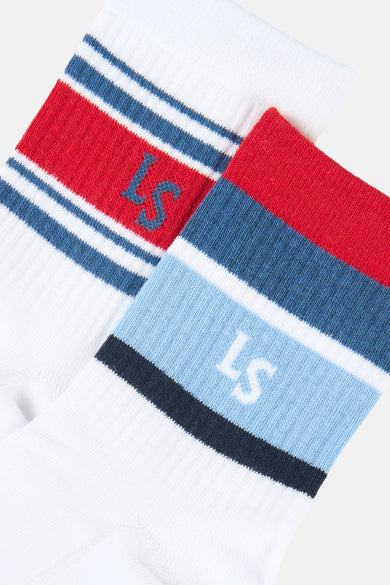 Chaussettes blanches Levi's® Accessories, avec des rayures rouges et bleues et un logo brodé.