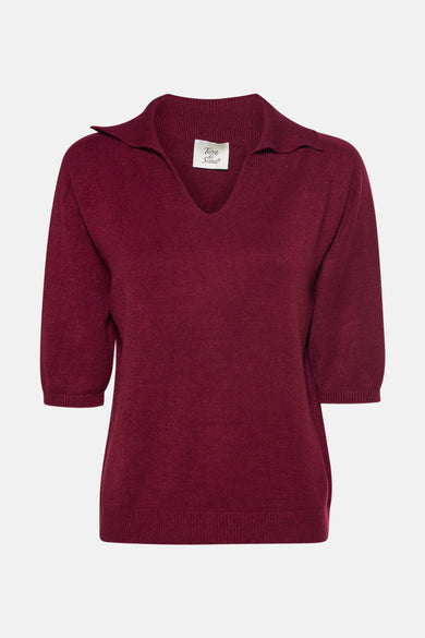 Polo de couleur bordeaux avec des manches longues de Terra di Siena, d'une texture fine et soyeuse.