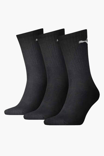Chaussettes noires de PUMA, avec un logo subtil sur le côté, texture côtelée.