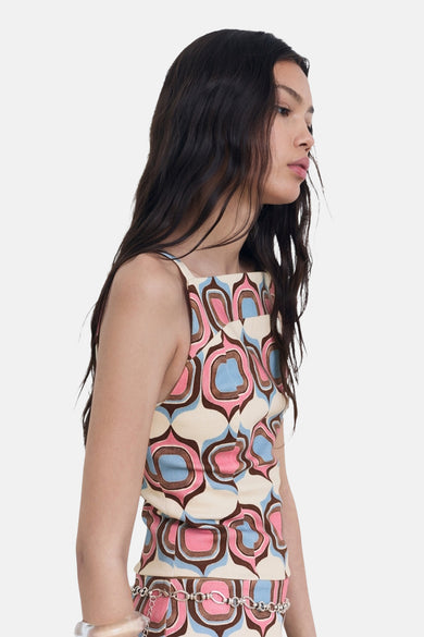 Blouse multicolore sans manches de MANGO, avec un motif graphique rétro, vue de côté.