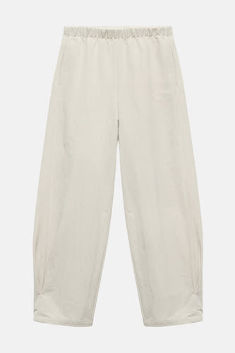 Ecru broek van MANGO, met elastische tailleband en wijde pijpen.