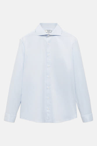 Chemise bleue à manches longues de MANGO, avec col classique et fermeture à boutons.