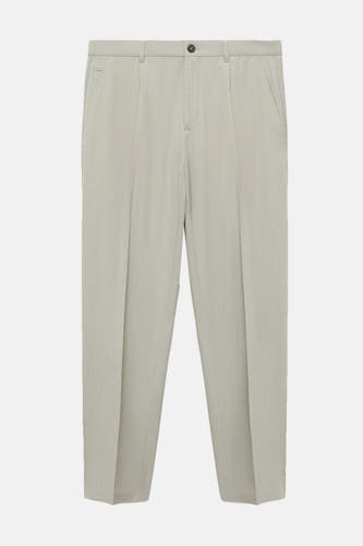 Pantalon gris à carreaux de MANGO avec plis et fermeture à glou.