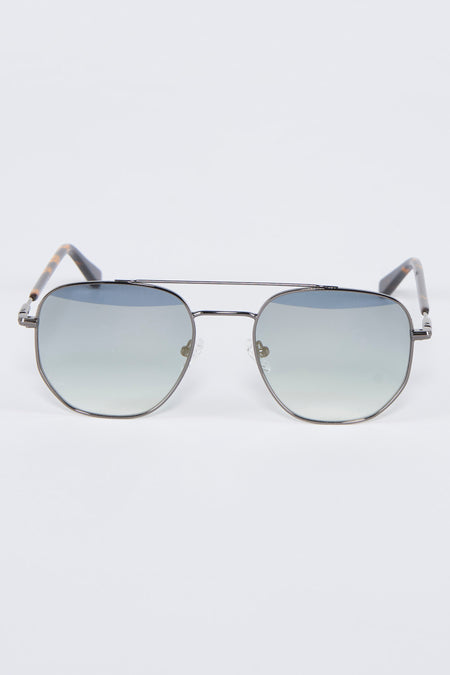 Lunettes de soleil grises d'Astrid Black Label, avec un cadre métallique et une impression de tortue brune sur les branches.