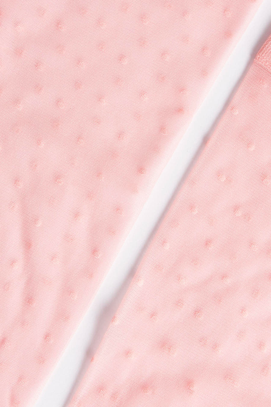 Chaussettes roses d'Astrid Black Label, avec un motif à points subtil et une douce texture.