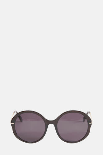 Lunettes de soleil noires d'Astrid Black Label, avec des verres ronds et des détails dorés sur les côtés.