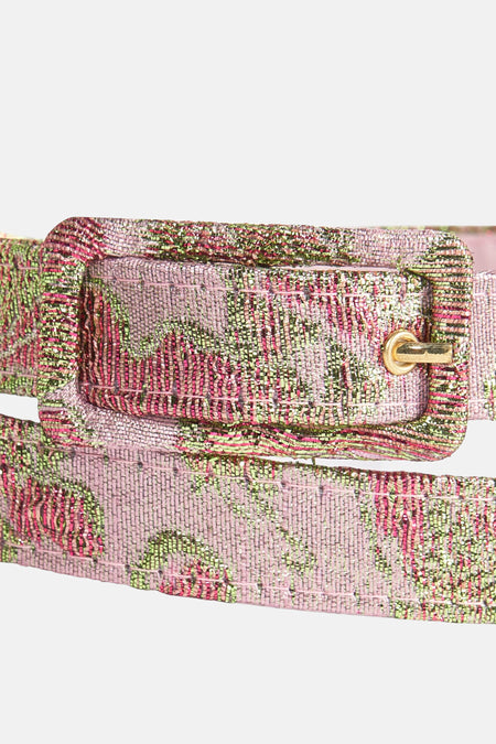 Ceinture rose Astrid Black Label, avec un motif de fleurs tissé et une boucle dorée.