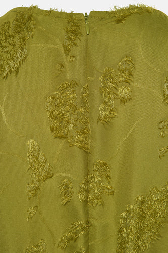 Olijfgroene stof met decoratieve elementen en ritssluiting.
