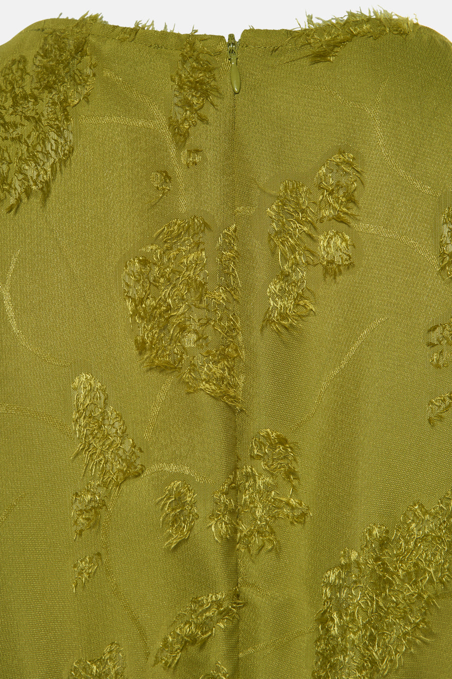 Olijfgroene stof met decoratieve elementen en ritssluiting.
