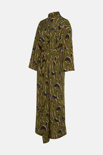 Robe verte avec longues manches d'Astrid Black Label, avec imprimé abstrait noir et rose et ceinture.