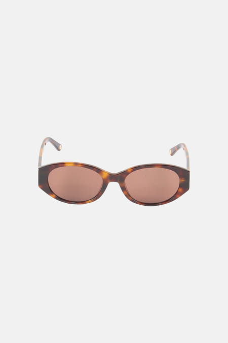 Lunettes à monture marron Astrid Black Label, avec un motif écaille de tortue.