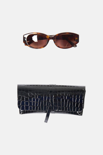 Lunettes marron Astrid Black Label avec une monture de lunettes de soleil.