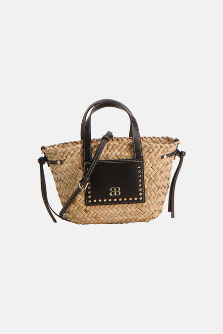 Sac à bandoulière beige Astrid Black Label avec détails noirs et texture tressée.