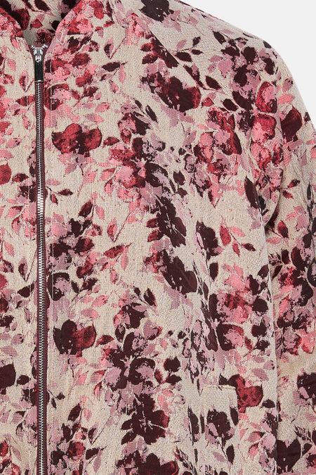Veste courte rose Astrid Black Label, avec imprimé floral et fermeture éclair argentée.