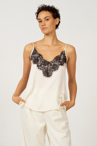 Blouse écrue sans manches Astrid Black Label avec des détails noirs et une culotte blanche coordonnée.