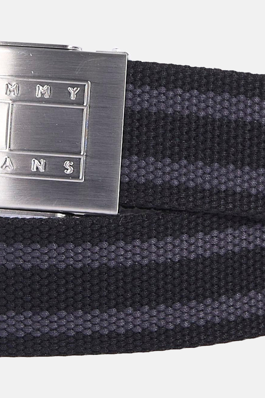 Ceinture noire de TOMMY JEANS avec un motif à rayures et une boucle argentée.