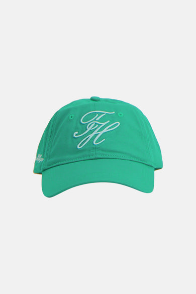 Casquette verte TOMMY JEANS avec logo blanc brodé, vue latérale.
