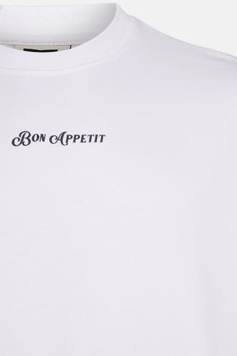 Pull-over blanc de KAOTIKO avec le texte "Bon Appétit" en noir.