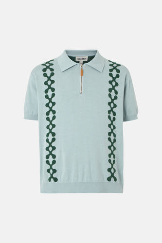 Polo bleu de KAOTIKO avec un motif graphique sur le devant et une fermeture éclair.