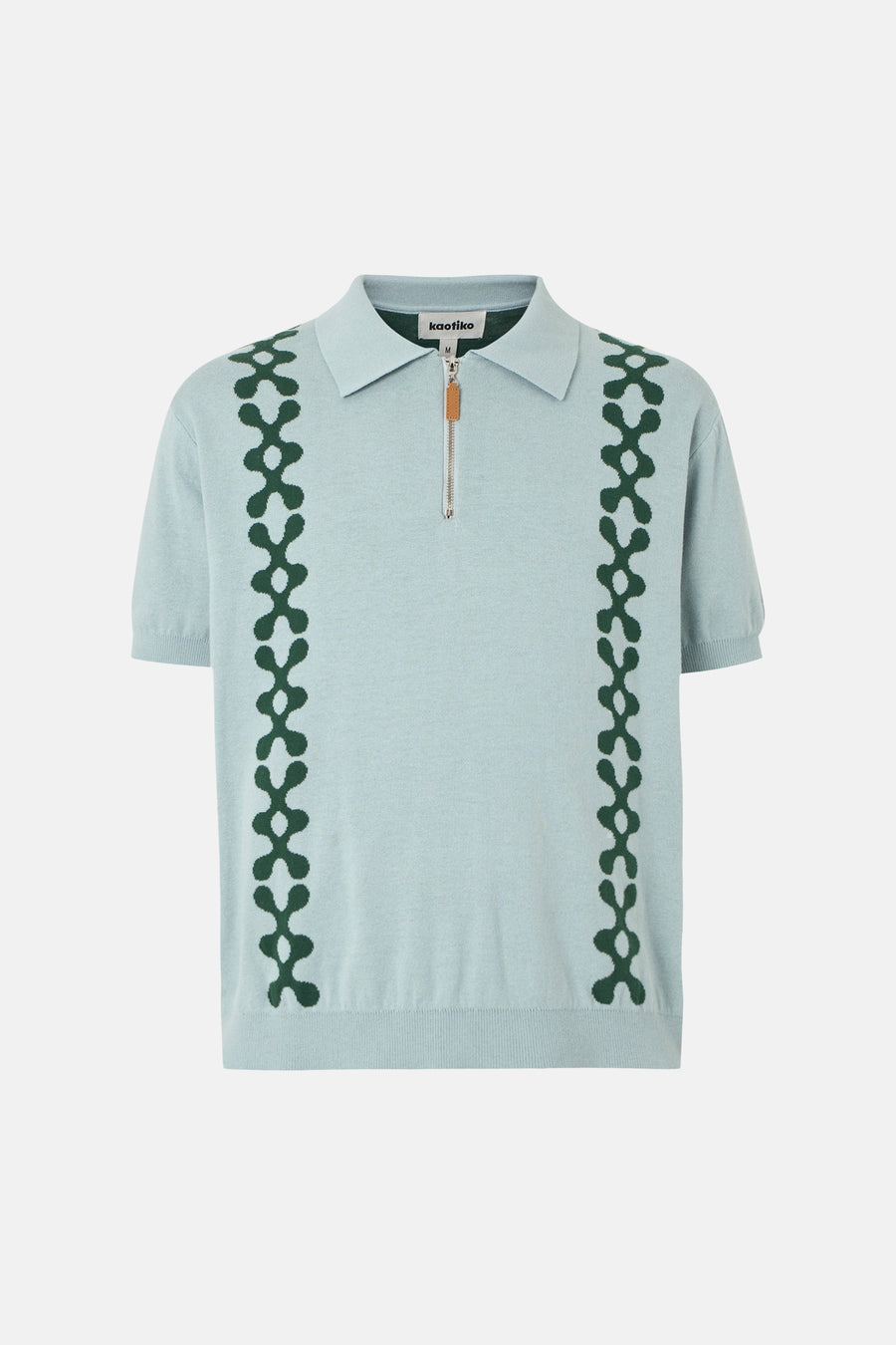 Polo bleu de KAOTIKO avec un motif graphique sur le devant et une fermeture éclair.