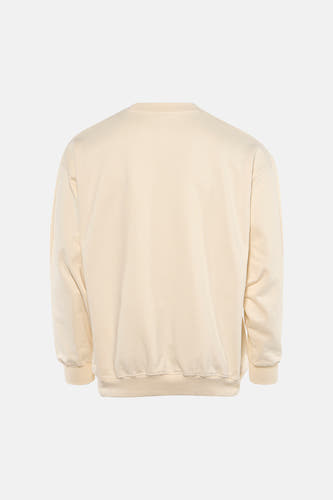Ecru sweater van KAOTIKO, achterkant met lange mouwen en een ronde hals.