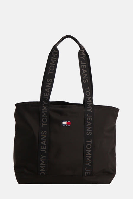 Sac à main noir de TOMMY JEANS avec des bandes logo et un petit logo sur l'avant.