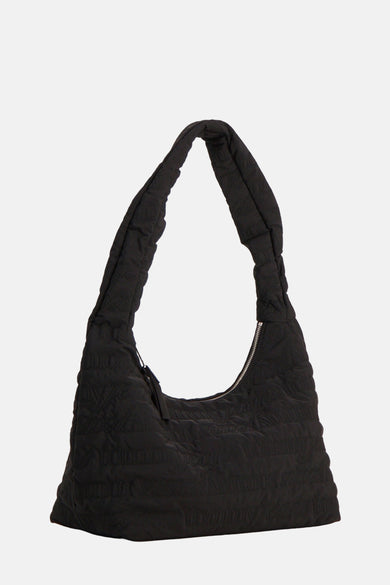 Sac à dos noir de TOMMY JEANS avec motif doublé et fermeture éclair argentée.