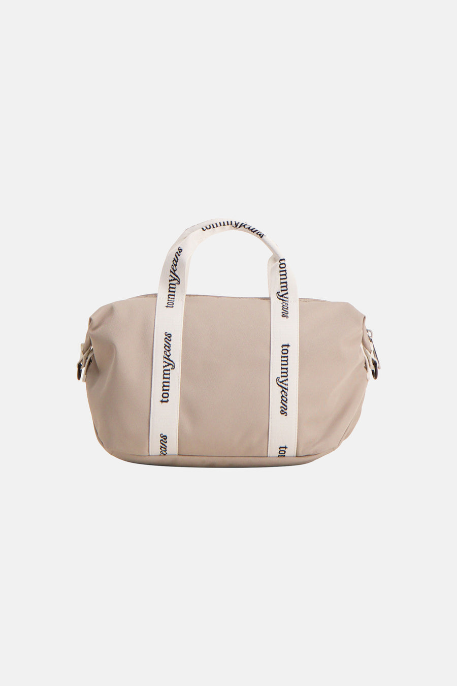 Beige schoudertas van Tommy Jeans, met witte handvatten en het logo 'tommyjeans' erop.